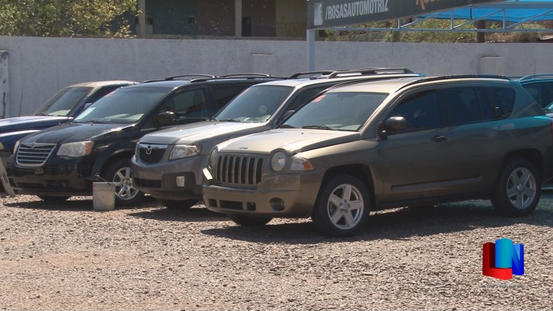 Cierran negocios de autos usados