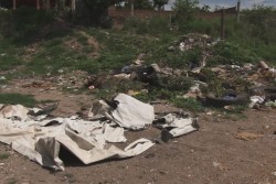 Lote baldío lleno de basura