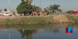 Cae auto a canal; fallecen dos menores.